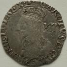 CHARLES I 1634 -1635 CHARLES I SHILLING. TOWER MINT. NO INNER CIRCLES. REVERSE ROUND GARNISHED SHIELD. MM BELL VF